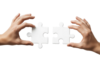 Two Hands Holding Puzzle Pieces Ready to Connect on a White Background