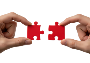 Two Hands Holding Matching Red Puzzle Pieces for Concept of Connection and Solution
