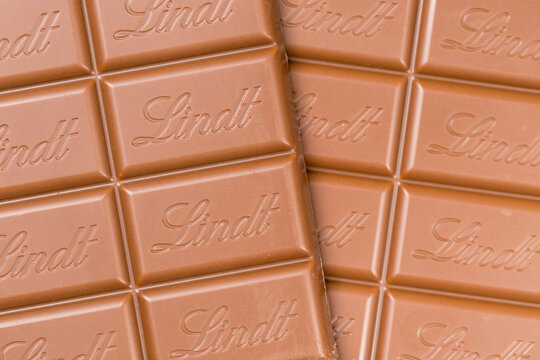 Lindt Swiss chocolate bar background close-up with company logo in Stuttgart, Germany