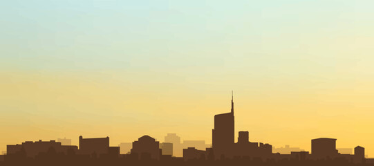 Fototapeta premium Panoramic poster of the city skyline with misty background buildings, hills sunrise, sunset and clouds of MILAN, ITALY