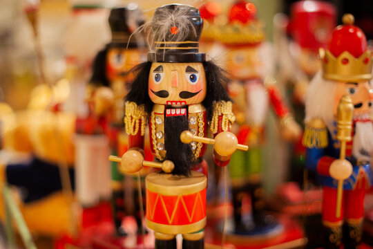 Classic wooden nutcracker soldiers stand in formation &mdash; festive, hand-painted Christmas figurines evoking traditional German holiday charm.