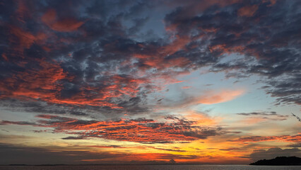 Beautiful sunset with combination of bright orange and grey color