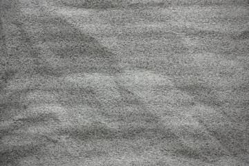 Abstract monochrome background creating soft textured waves suitable for design layouts, product presentations, overlays and modern minimalist graphics