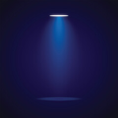 An illuminated spotlight shining down on a dark background. The scene is illuminated by the spotlight
