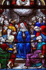 Stained glass (19th century) of Pentecost Sunday: The Holy Spirit Comes and descending on disciples as Tongues of Fire.