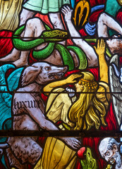 Stained glass (19th century) of Vision of hell and demons tormenting souls.