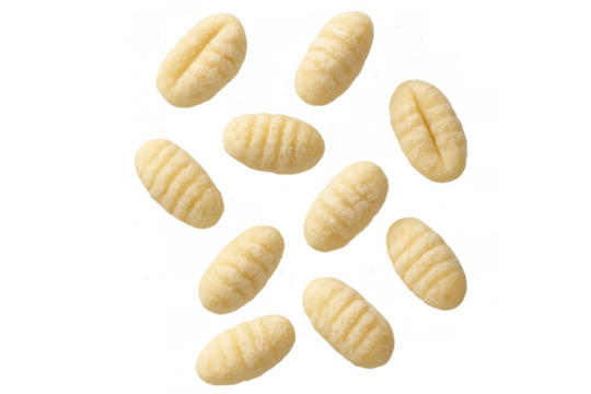 Uncooked potato gnocchi falling, traditional italian pasta dumplings, delicious carbohydrate food on transparent background