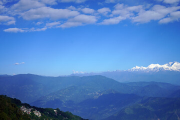 Majestic Himalayas View with Snowy Kanchenjunga Peak Over Green Rolling Hills