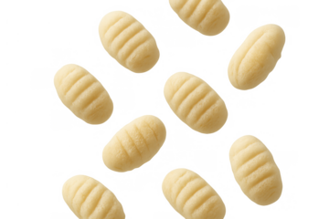 Gnocchi floating, uncooked potato dumplings, traditional italian pasta cuisine, raw food ingredient on transparent background