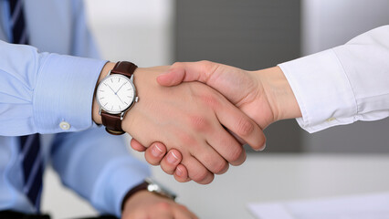 Business professionals completing a successful handshake in an office setting during a meeting Generative AI