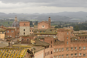 Panoramic view of Siena with the Church of San Martino and rooftops of the historic center, Tuscany, Italy.