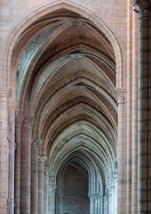 Fototapeta premium Gothic cathedral interior: vaults, stained glass and rose window.