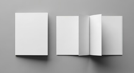 Fototapeta premium Three blank white brochures or booklets in various open and closed positions, perfect for mockup designs on a gray background