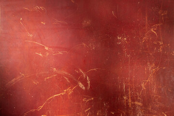 Rusty red metal texture background. Creative, abstract backdrop with scratches and stains. Old worn iron garage door detail. Rough, rustic, moody, eerie, dark, grunge wall. Close up, copy space