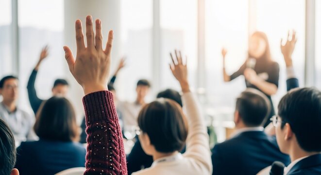 Enthusiastic audience raising hands at modern conference, participating in dynamic Q&A session with engaging speaker, fostering collaboration and discussion