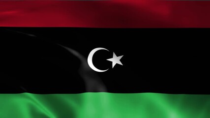 libya national flag with crescent and star symbol displayed in soft lighting and elegant flowing fabric texture