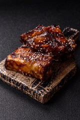 Grilled or bbq pork ribs with sauce, a food prepared for dinner. Grilled ribs