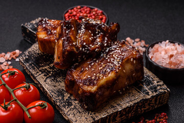 Grilled or bbq pork ribs with sauce, a food prepared for dinner. Grilled ribs