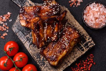 Grilled or bbq pork ribs with sauce, a food prepared for dinner. Grilled ribs