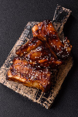 Grilled or bbq pork ribs with sauce, a food prepared for dinner. Grilled ribs