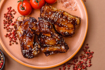 Grilled or bbq pork ribs with sauce, a food prepared for dinner. Grilled ribs
