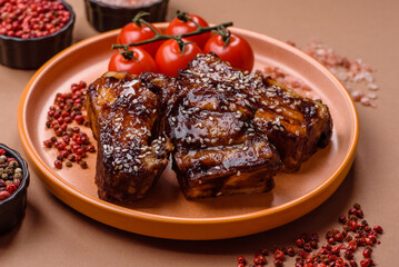 Grilled or bbq pork ribs with sauce, a food prepared for dinner. Grilled ribs