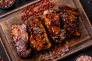 Grilled or bbq pork ribs with sauce, a food prepared for dinner. Grilled ribs