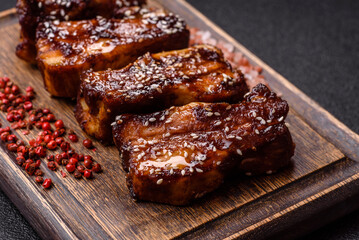 Grilled or bbq pork ribs with sauce, a food prepared for dinner. Grilled ribs