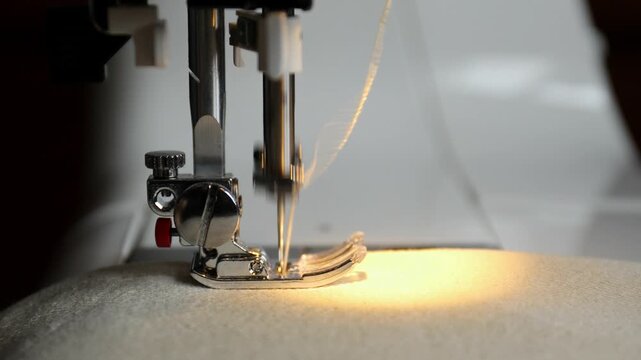 Side View of Sewing Machine Stitching with Light Thread. Horizontal Video