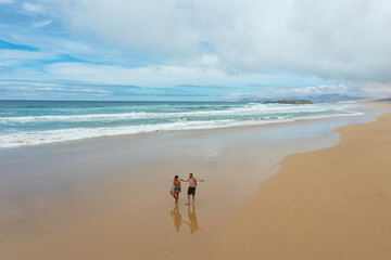 Aerial view of a couple walking on Cofete Beach, Fuerteventura, Canary Islands