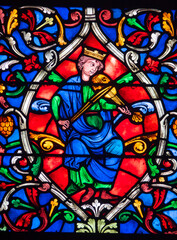 Stained glass (19th century) of a musician. Angel, heaven, paradise, sky,