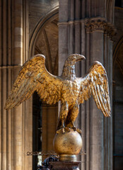 Golden eagle statue in a Gothic cathedral.