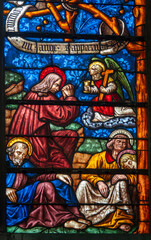 Obraz premium Stained glass (16th century) of The prayer of Jesus in the Garden of Gethsemane with the sleeping disciples.