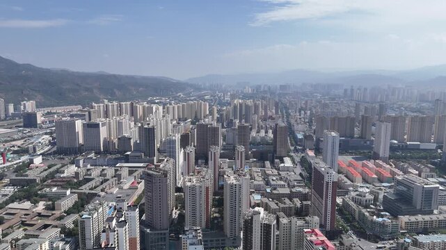 Xining Cityscape - Aerial View of Tall Buildings and Mountains
