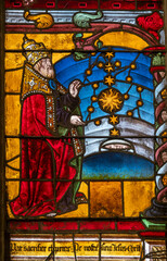 Stained glass (16th century) of the Creation of the Stars by God.