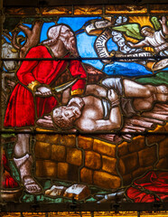 Stained glass (19th century) of Abraham is stopped by an angel as he prepares to sacrifice his only son Isaac.