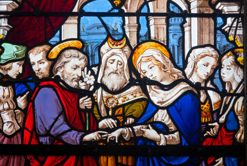 Fototapeta premium Stained glass (19th century) of Holy family: The wedding of Mary and Joseph.