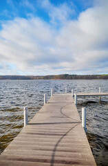 Fototapeta premium Pier on Lake Charzykowskie in autumn, Charzykowy, Poland.