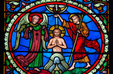 Stained glass (19th century) of Baptism of Jesus by John the Baptist in the Jordan river.