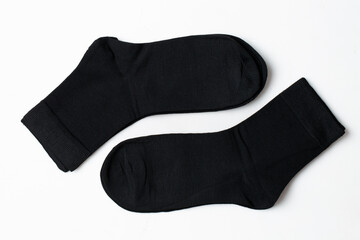 Black socks on a white background Casual clothing.