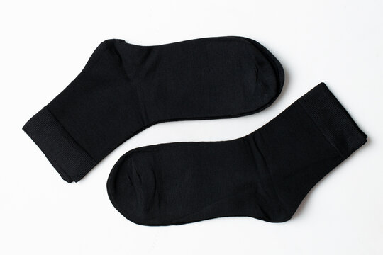 Black socks on a white background Casual clothing.
