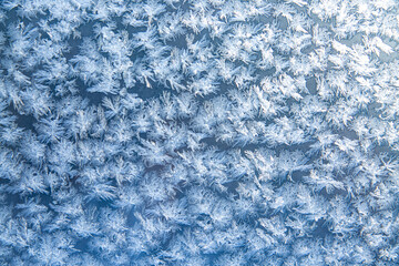 Pattern of frost on the window pane. Beauty of nature. Frost texture.