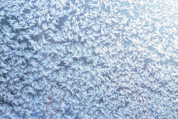 Pattern of frost on the window pane. Beauty of nature. Frost texture.