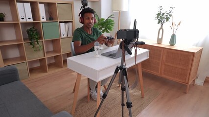 Young african american vlogger streaming video games