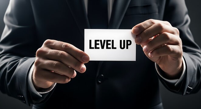 Professional holding 'Level Up' card, symbolizing career advancement and personal skill development journey