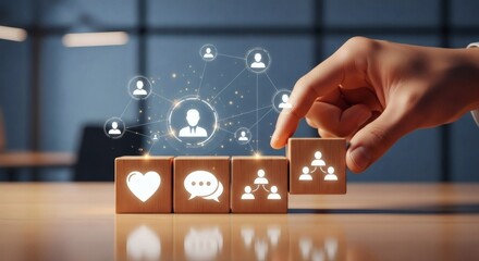 Human connection and team communication concept. Illuminated social icons on wooden blocks with hand selecting team structure symbol in modern office environment