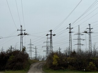 Power lines crossing rural landscape
