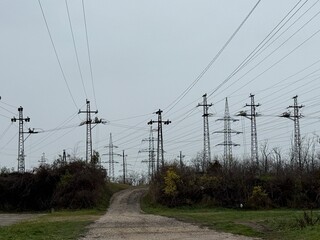 Power lines crossing rural landscape
