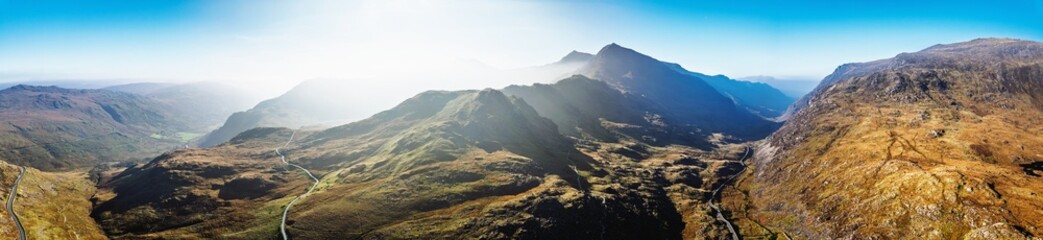 Autumn colours of Pen-y-Pass over Miner’s Track - Start Point and road A4086 from a drone,...