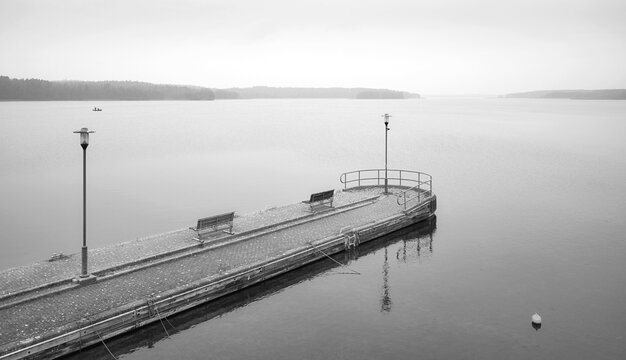 Pier on Lake Charzykowskie on a foggy autumn day, Charzykowy, Poland. - Powered by Adobe